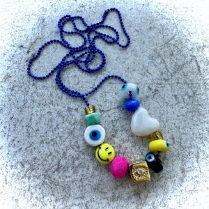 Collier Rudy, perles fun et colorées poisson, oeil arc-en-ciel, smiley, yin, étoile, coeur.